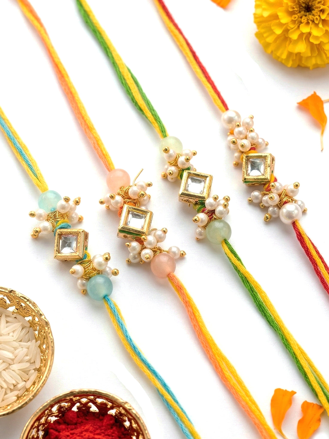 KARATCART Set of 4 Pastel Pearl Beads Square Polki Kundan Rakhi for Brother with Roli & Chawal