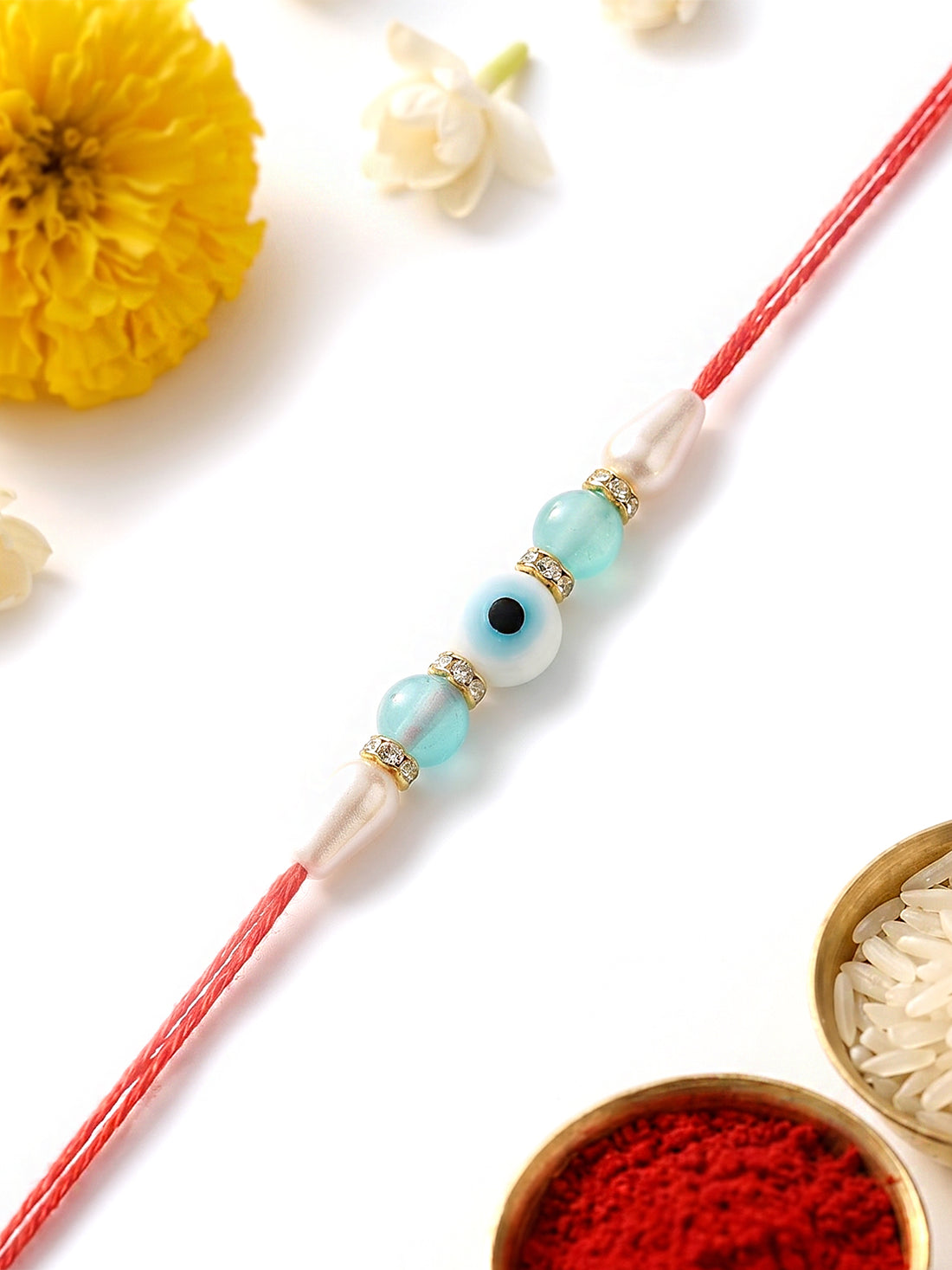 KARATCART Stylish Light Blue Beads Evil Eye Handmade Rakhi for Brother with Roli & Chawal