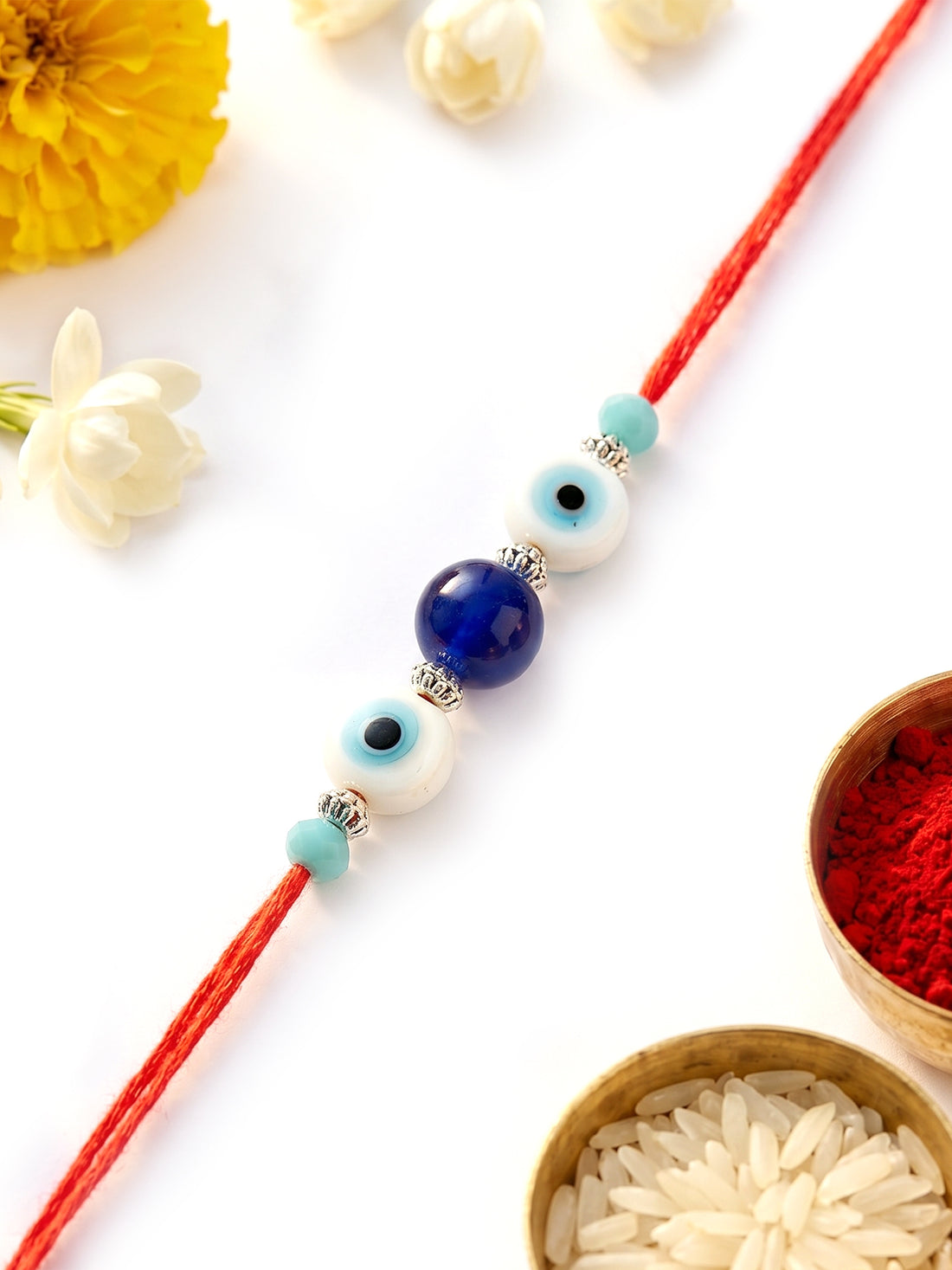 KARATCART Stylish Blue Bead Evil Eye Handmade Rakhi for Brother with Roli & Chawal
