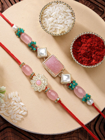 KARATCART Set of 2 Pink Carved Stone Floral Handmade Kundan Rakhi for Brother with Roli & Chawal