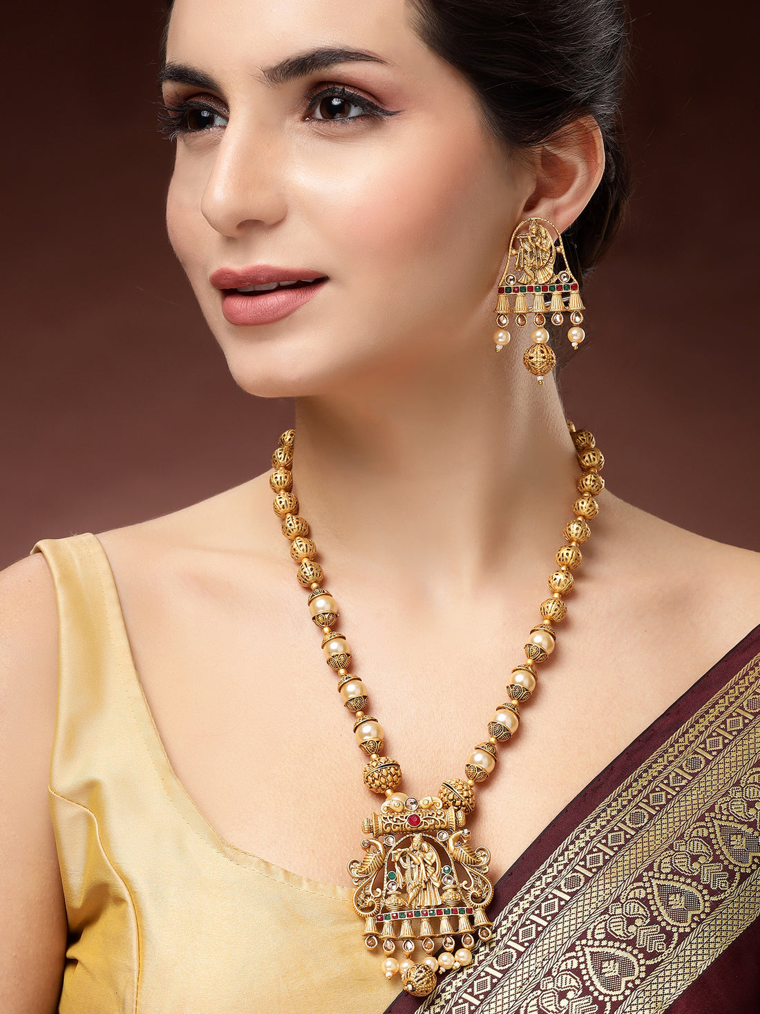 Karatcart Elegant Gold-Plated Radha Krishna Rani Haar Necklace Set with Red and Green Stones