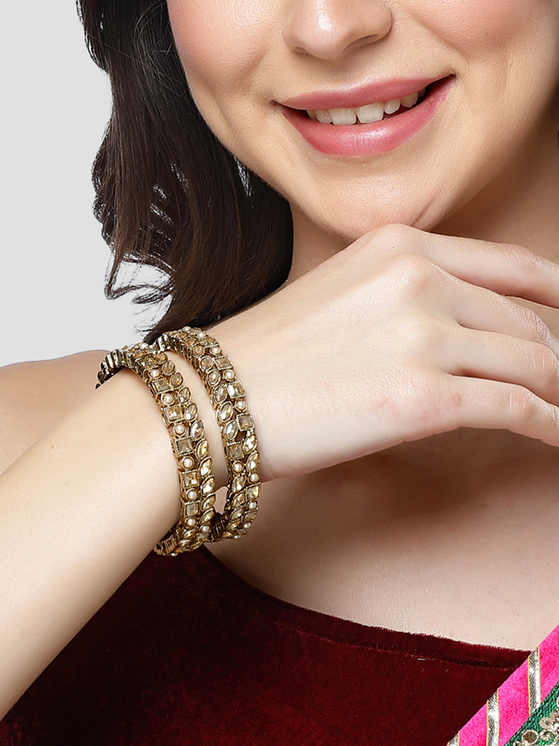Karatcart Set of 2 Golden Kundan and Moti Studded Antique Gold Plated Bangles for Women
