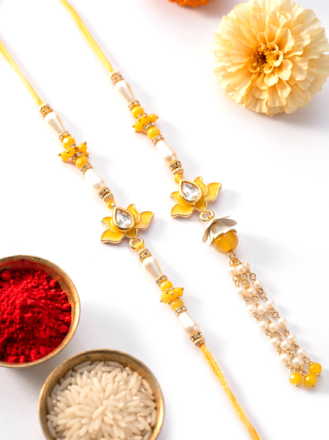 KARATCART Gold Plated Yellow Lotus Floral Kundan Bhaiya Bhabhi Rakhi with Roli & Chawal