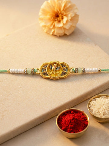 KARATCART Gold Plated Yellow Meena Ganesha Kundan Bhaiya Rakhi with Roli & Chawal