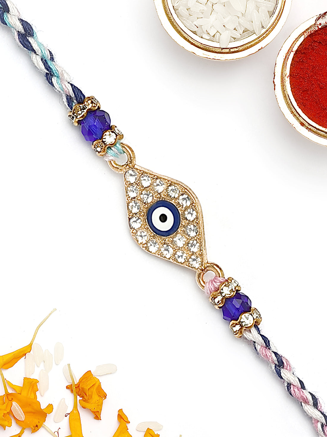 KARATCART Gold Plated Blue American Diamond Diamond Shape Evil Eye Bhaiya Rakhi with Roli & Chawal