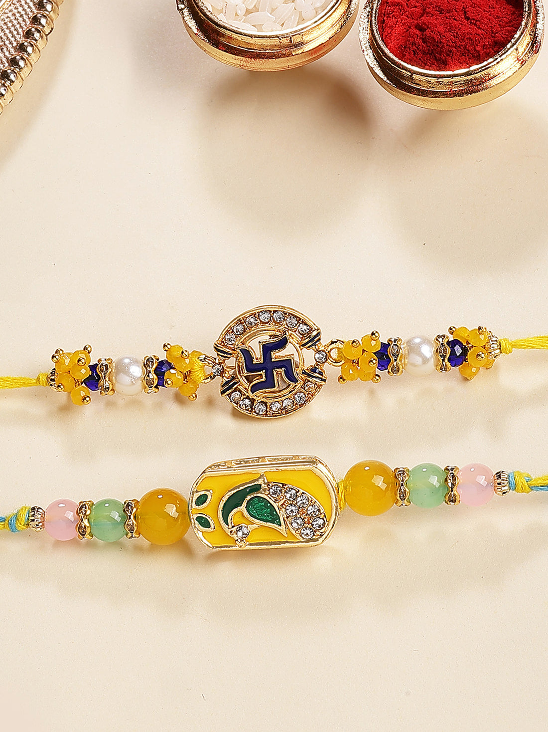 Karatcart Set of 2 Peacock and Swastik Design Enamel Kundan Rakhi for Brother with Roli & Chawal