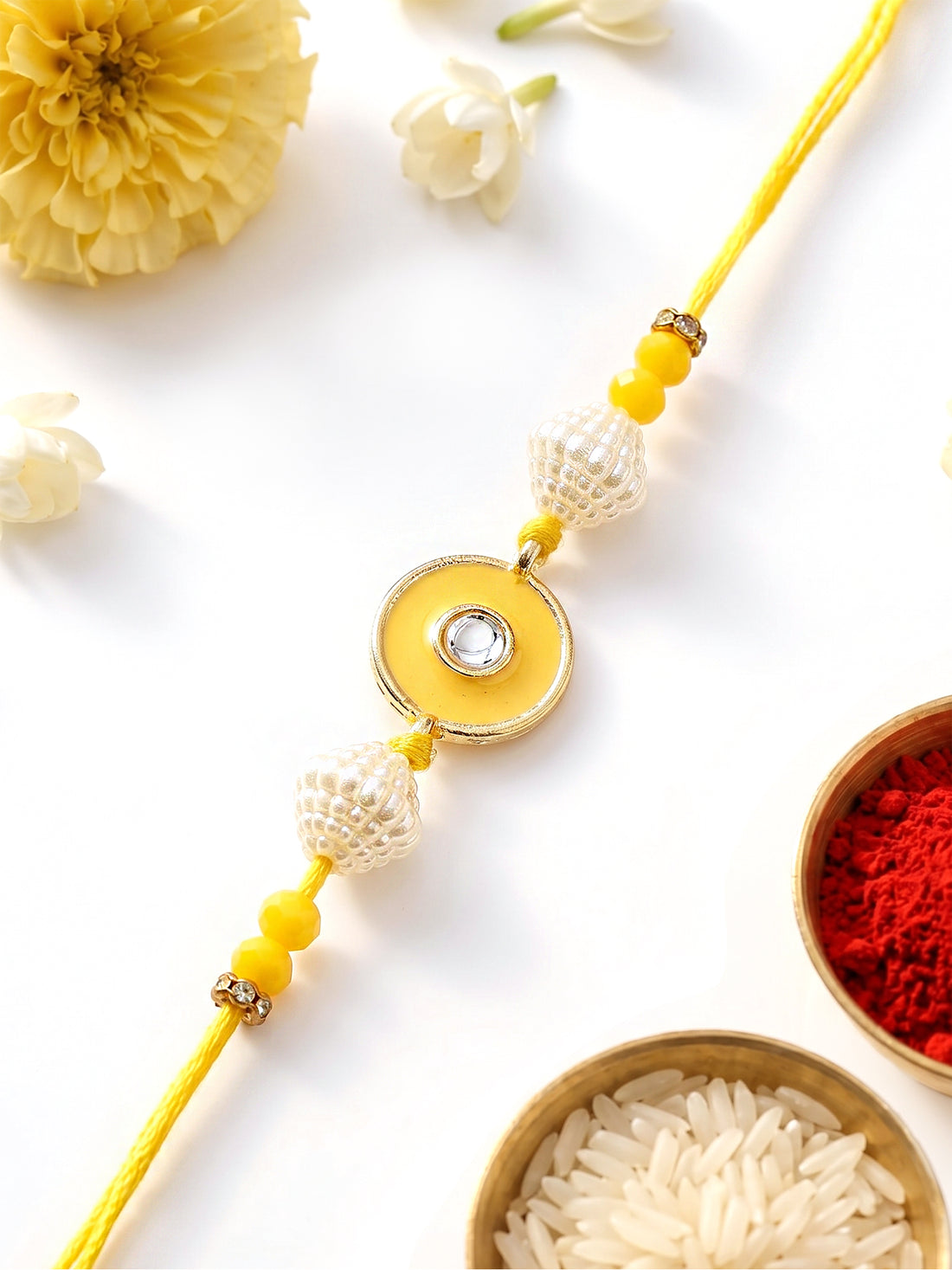 KARATCART Vibrant Yellow Meena Evil Eye Design Handmade Kundan Rakhi for Brother with Roli Chawal
