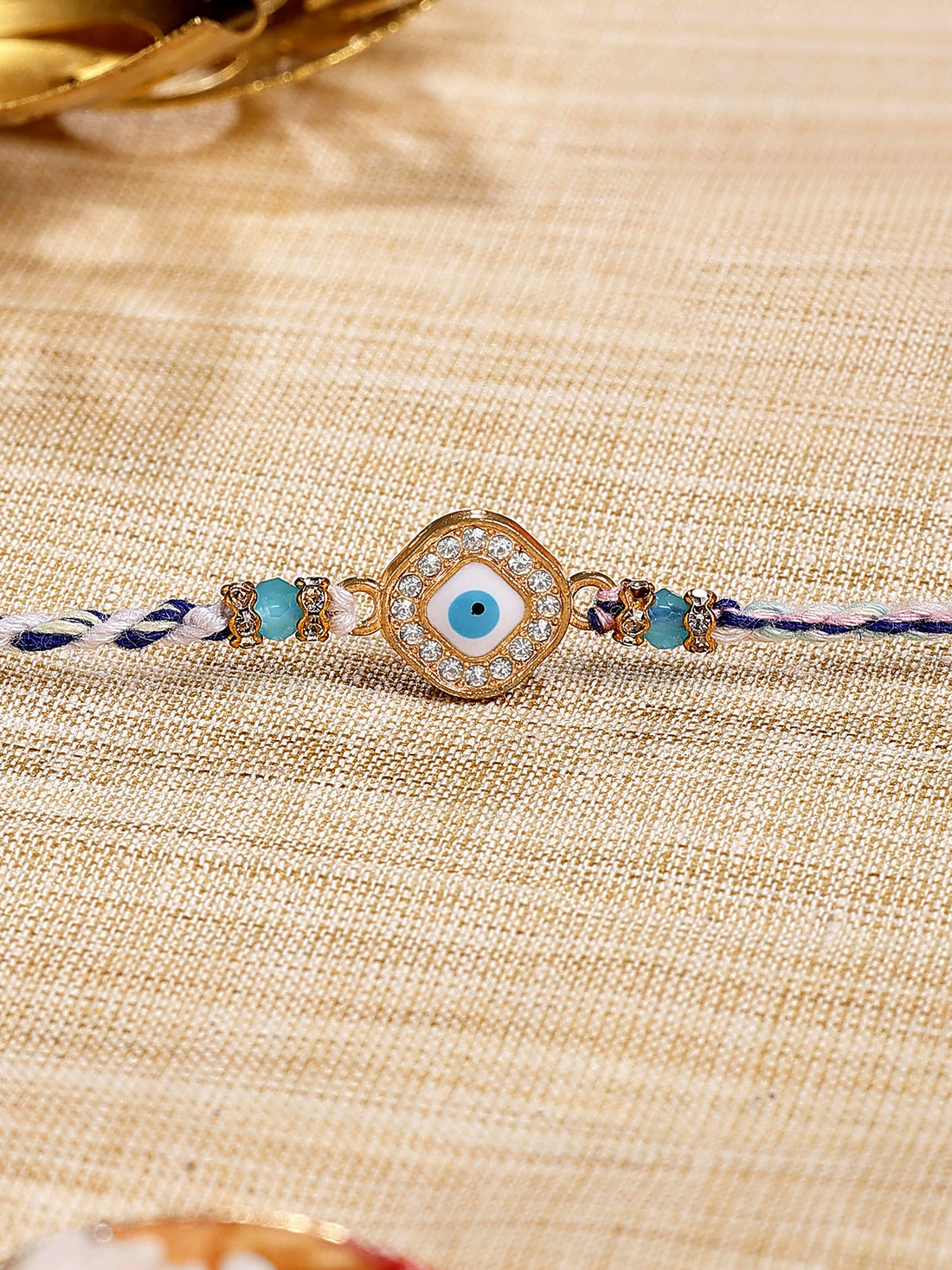 Karatcart Gold Plated Blue American Diamond Square Evil Eye Bhiya Rakhi with Roli & Chawal