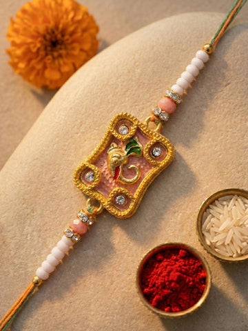 KARATCART Gold Plated Pink Meena Ganesha Kundan Bhaiya Rakhi with Roli & Chawal