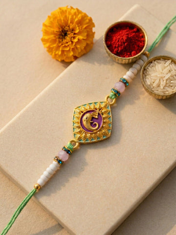 KARATCART Gold Plated Purple Meenakari Lord Ganesha Bhaiya Rakhi with Roli & Chawal