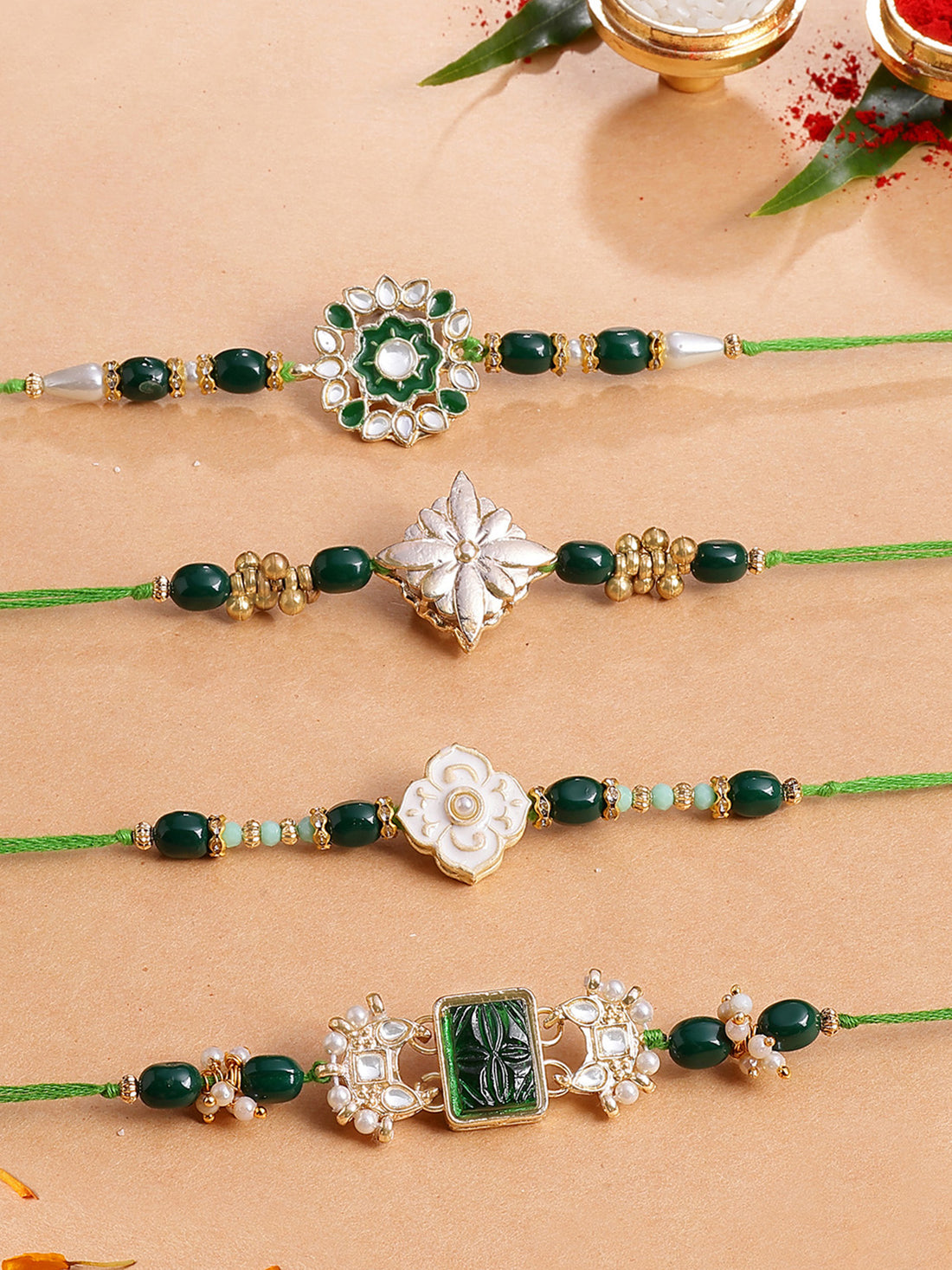 Karatcart Set of 4 Green Carved Stone Floral Kundan Rakhi for Brother with Roli & Chawal