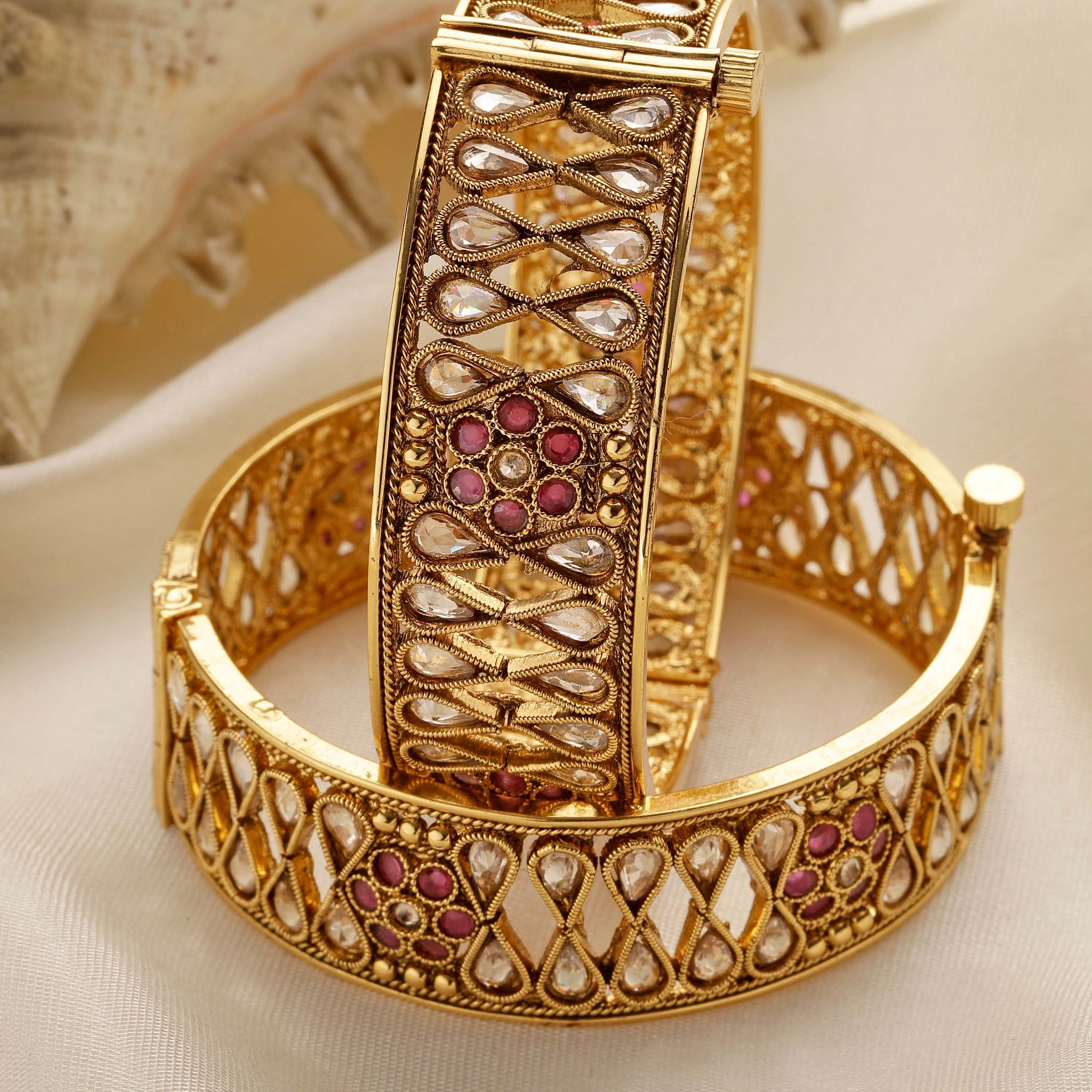 Karatcart Set of 2 Antique Gold Plated Drop Shape Floral Design Bangles for Women