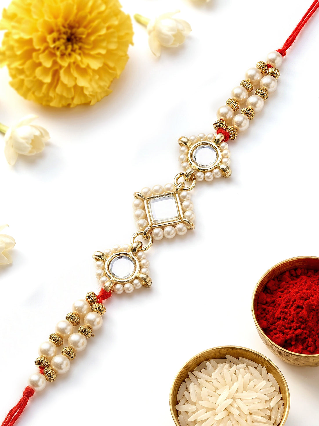 KARATCART Beautiful Classic Pearls and Kundan Handmade Rakhi for Brother with Roli & Chawal