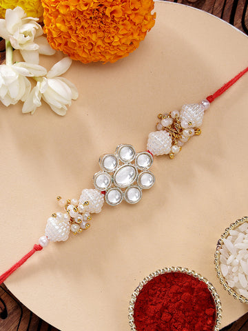 KARATCART Golden Floral Design Pearl and Kundan Handmade Rakhi for Brother with Roli & Chawal