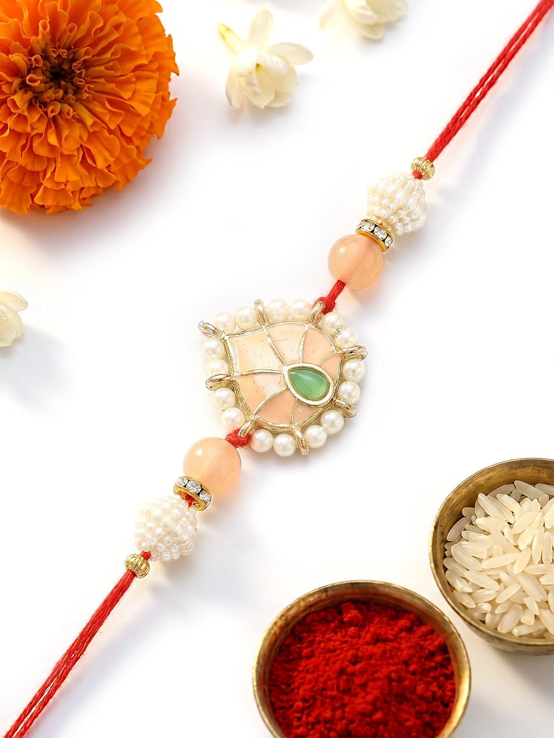 KARATCART Special Peach Meenakari Handmade Heart Shape Kundan Rakhi for Brother with Roli & Chawal