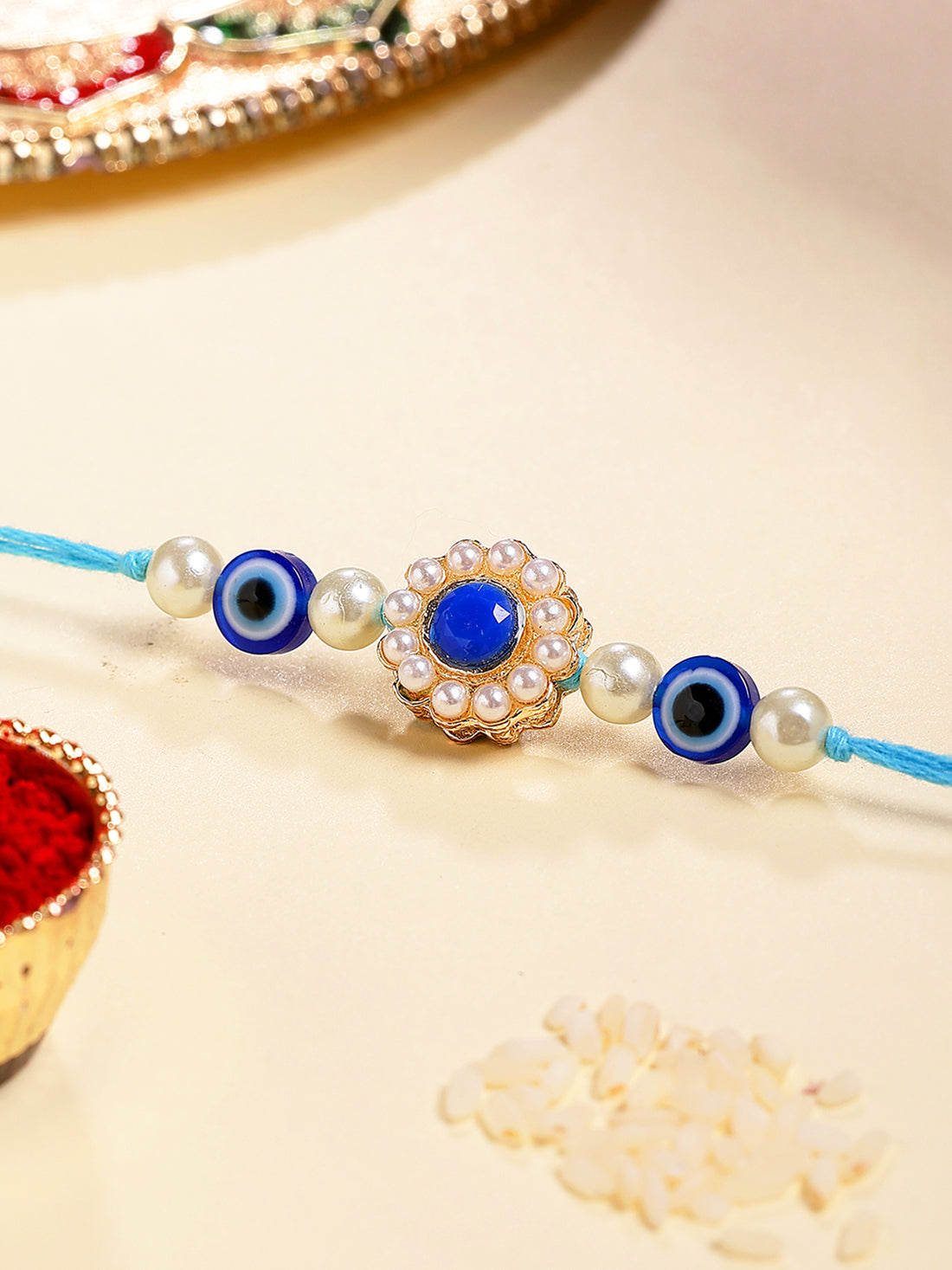 Karatcart Gold Plated Blue Evil Eye Kundan Bhiya Rakhi with Roli & Chawal