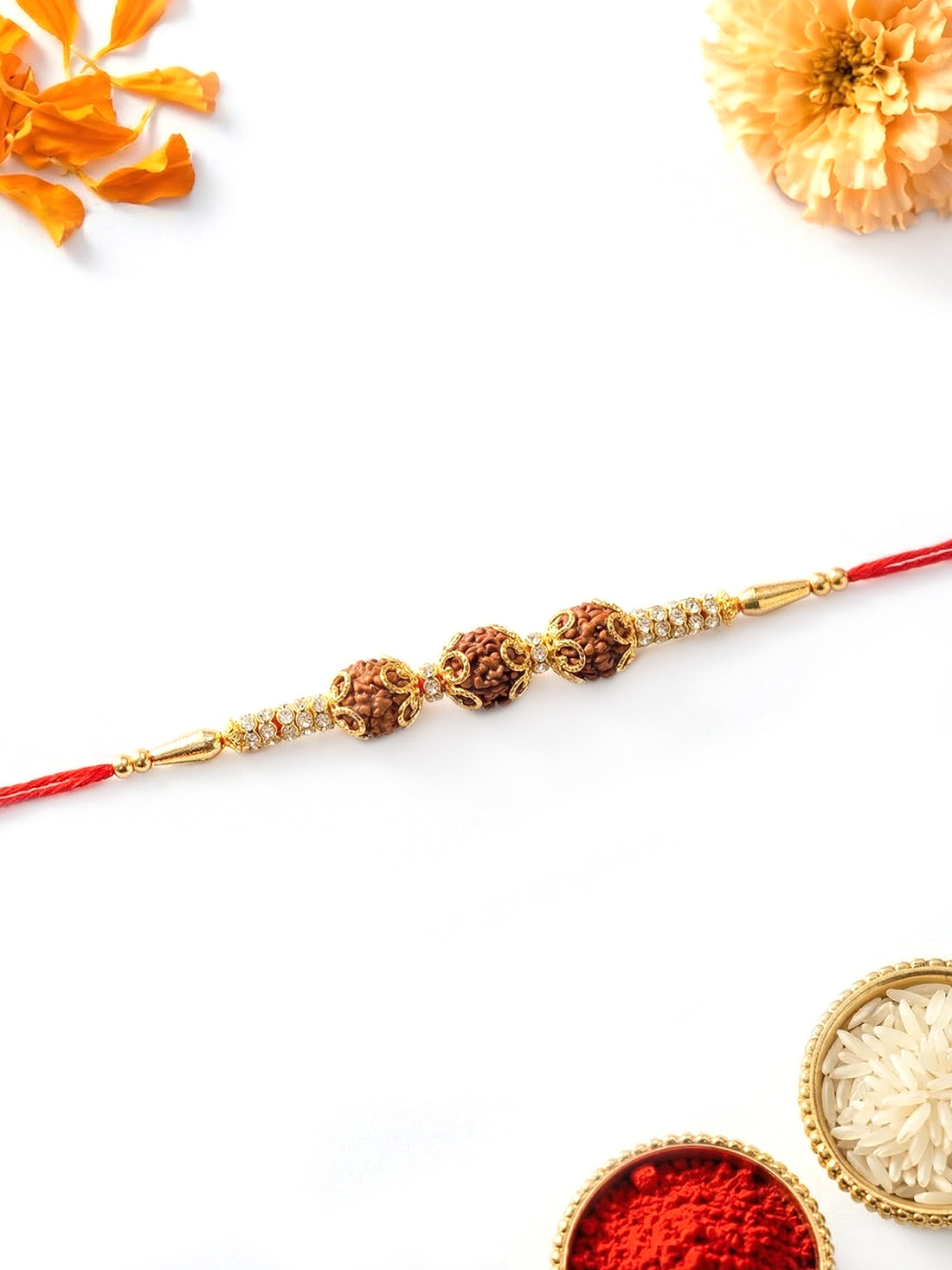 KARATCART Gold Plated Triple Rudraksha Studded Bhaiya Rakhi with Roli & Chawal