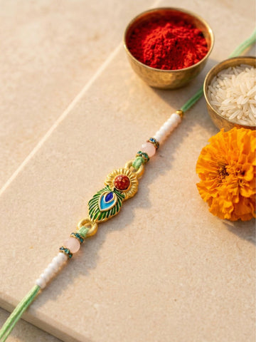 KARATCART Gold Plated Rudraksha and Peacock Feather Design Bhaiya Rakhi with Roli & Chawal
