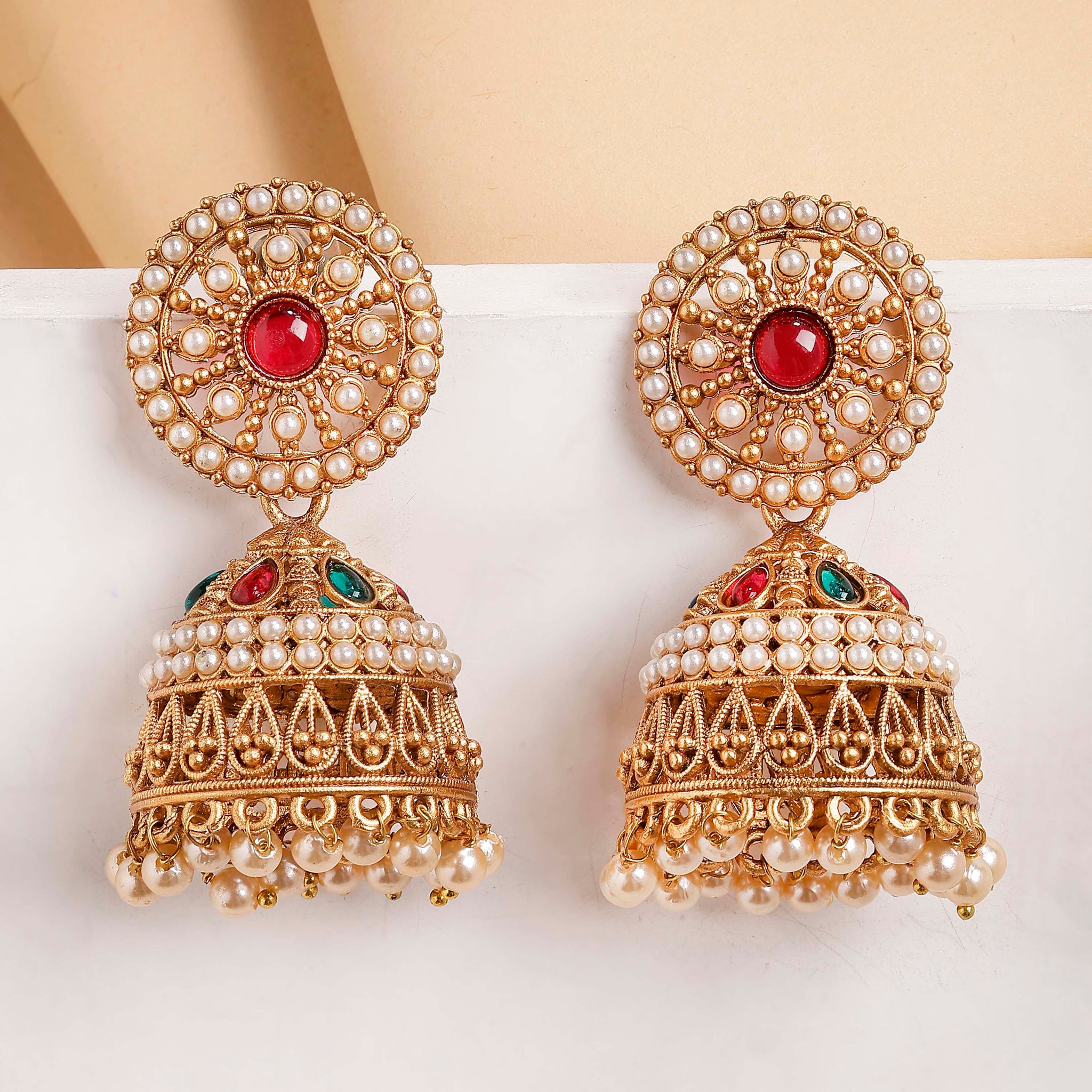 Karatcart Antique Gold Plated Jhumka Earrings with Pearl Beads & Red Stone Center