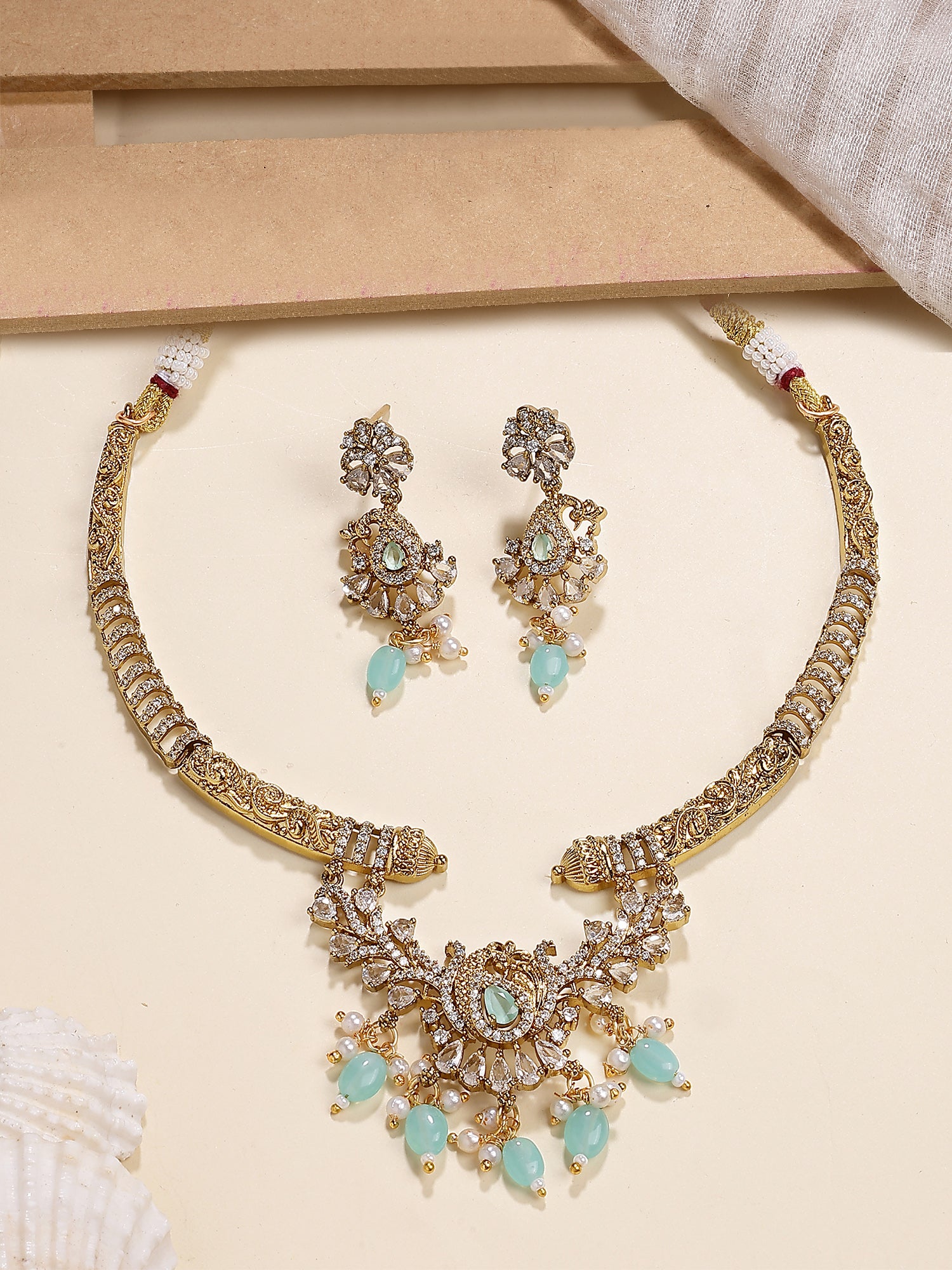Karatcart Dazzling Light Blue Tumble American Diamond Peacock Design Necklace Set for Women