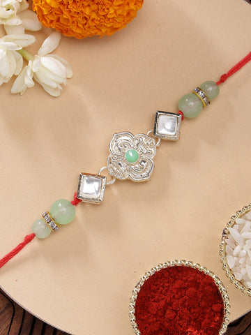 KARATCART Beautiful Floral Design Light Green Kundan Handmade Rakhi for Brother with Roli & Chawal