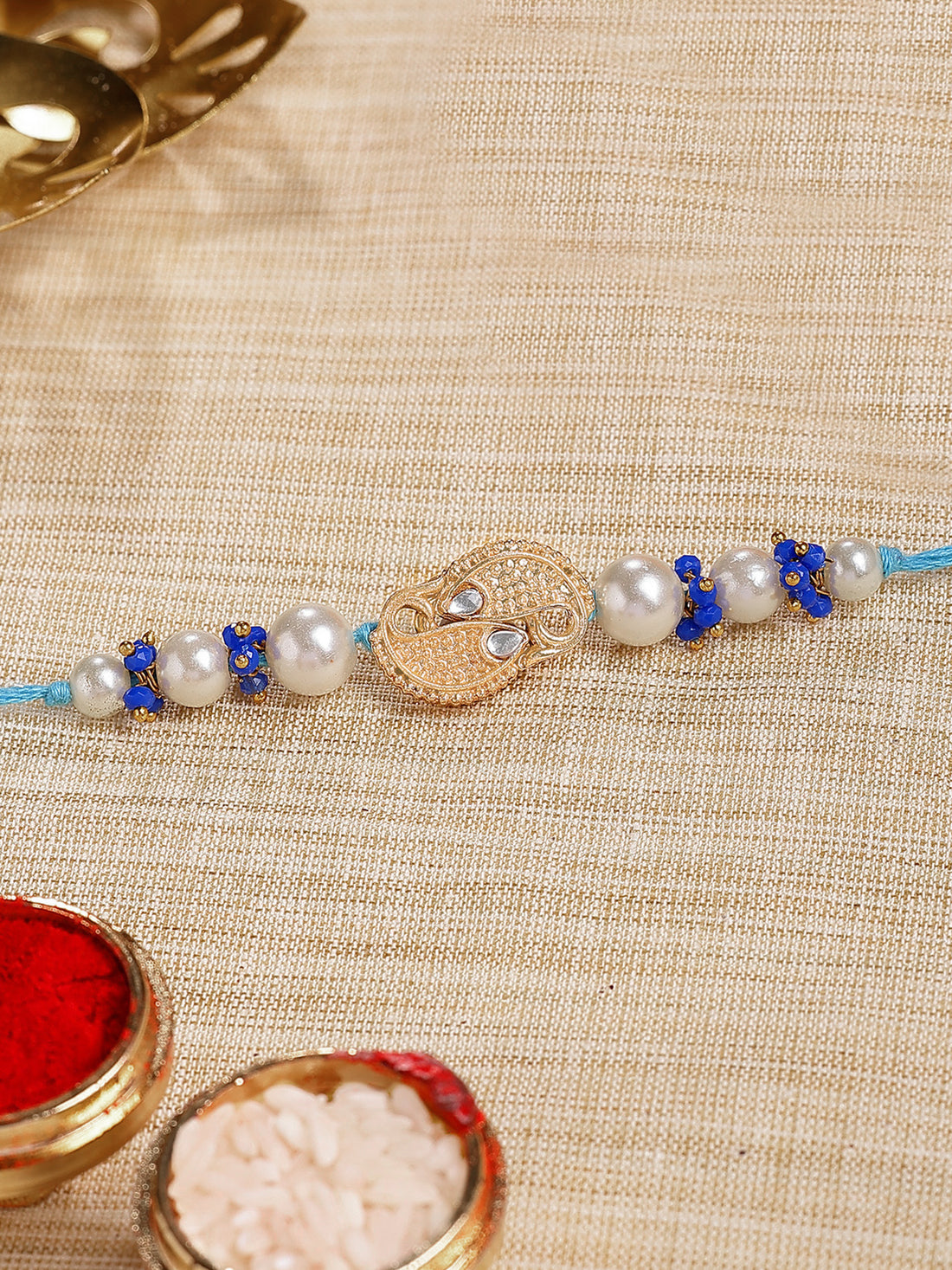 Karatcart Gold Plated Fish Design Blue Crystal Kundan Bhiya Rakhi with Roli & Chawal