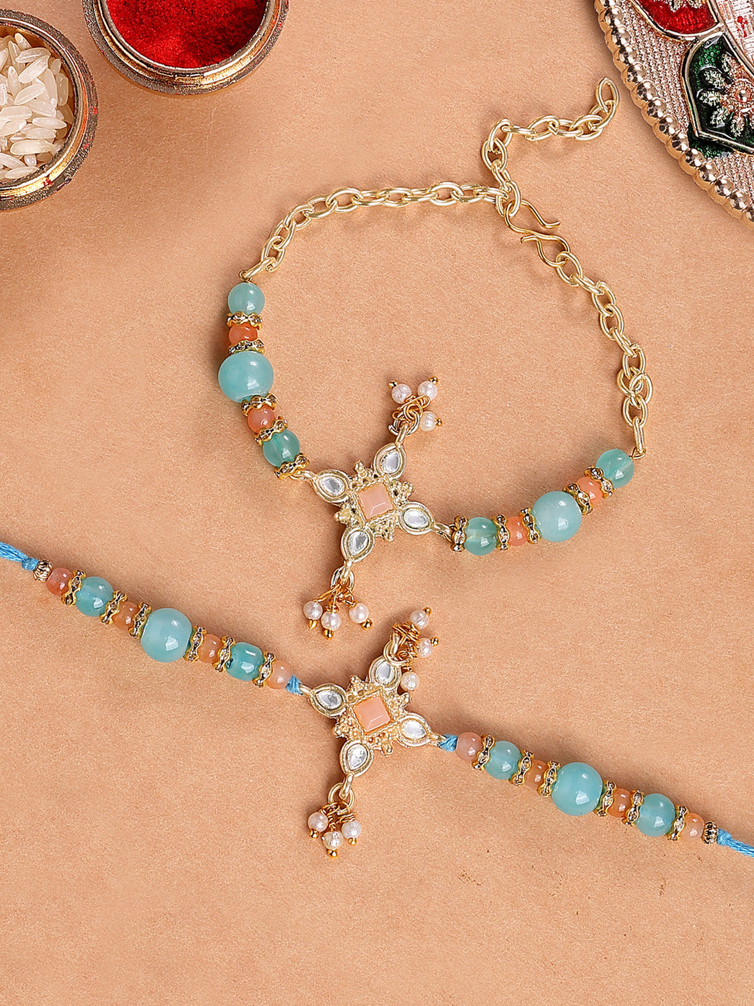 Karatcart Gold Plated Light Blue and Peach Beads Kundan Bhiya Bhabhi Rakhi with Roli & Chawal