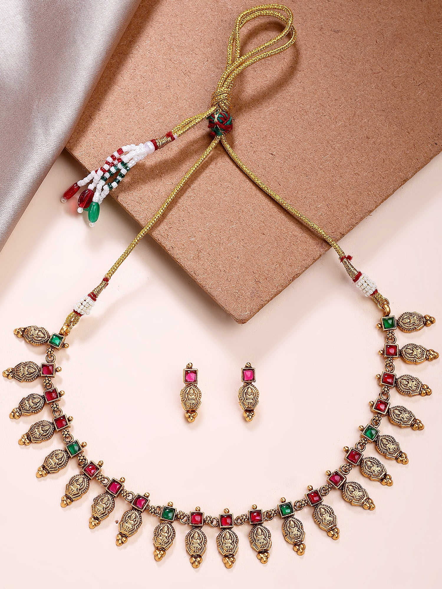 KARATCART Traditional South Indian Gold Plated Red and Green Stone Laxmi Mata Temple Jewellery Set