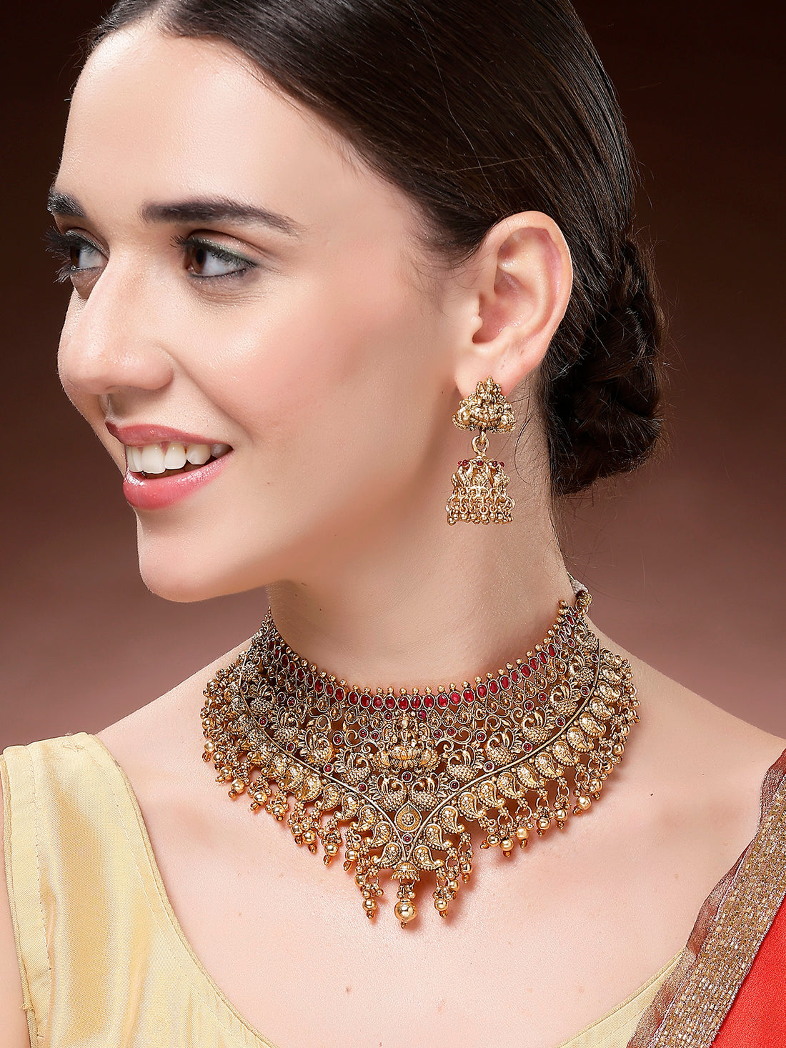 Karatcart Traditional Red Stone Laxmi Mata and Peacock Choker Temple Jewellery Set for Women