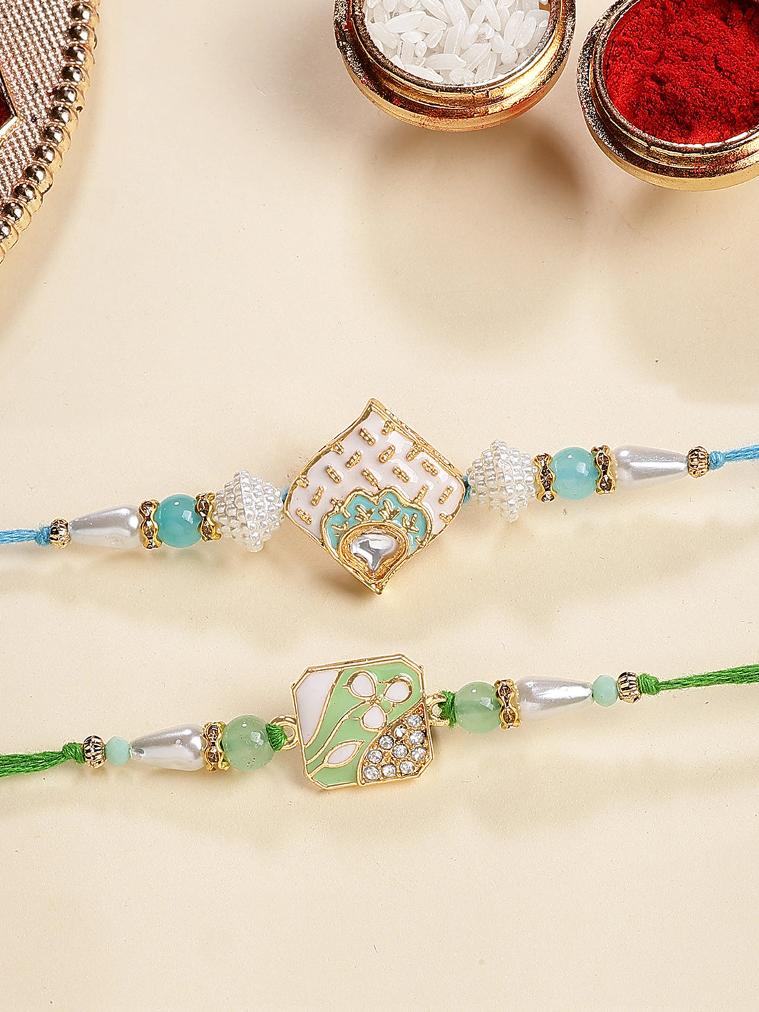 Karatcart Set of 2 White and Light Green Enamel Floral Kundan Rakhi for Brother with Roli & Chawal