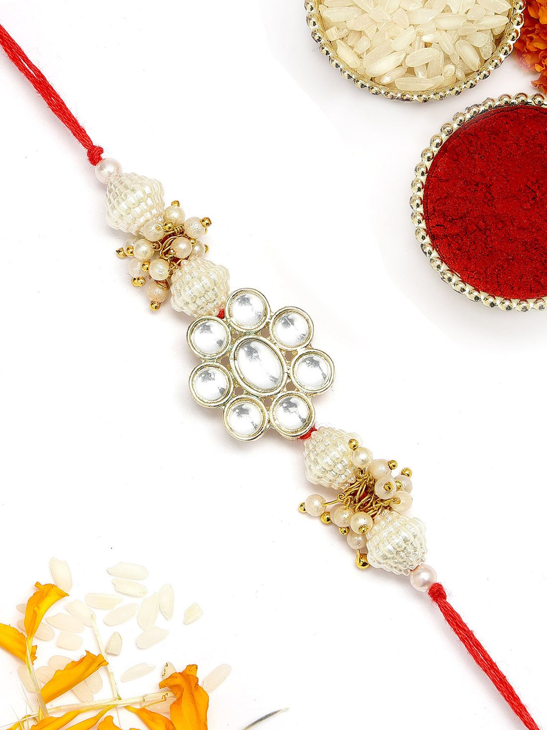 KARATCART Golden Floral Design Pearl and Kundan Handmade Rakhi for Brother with Roli & Chawal