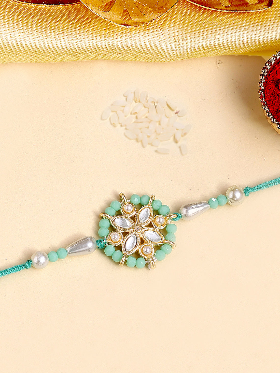 Karatcart Gold Plated Light Blue Crystal Floral Kundan Bhiya Rakhi with Roli & Chawal