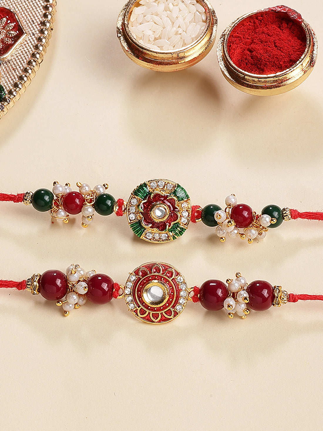 Karatcart Set of 2 Red and Green Enamel Floral Kundan Rakhi for Brother with Roli & Chawal