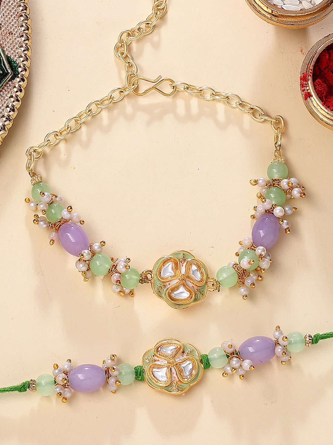 Karatcart Gold Plated Lime Green and Purple Beads Kundan Bhiya Bhabhi Rakhi with Roli & Chawal