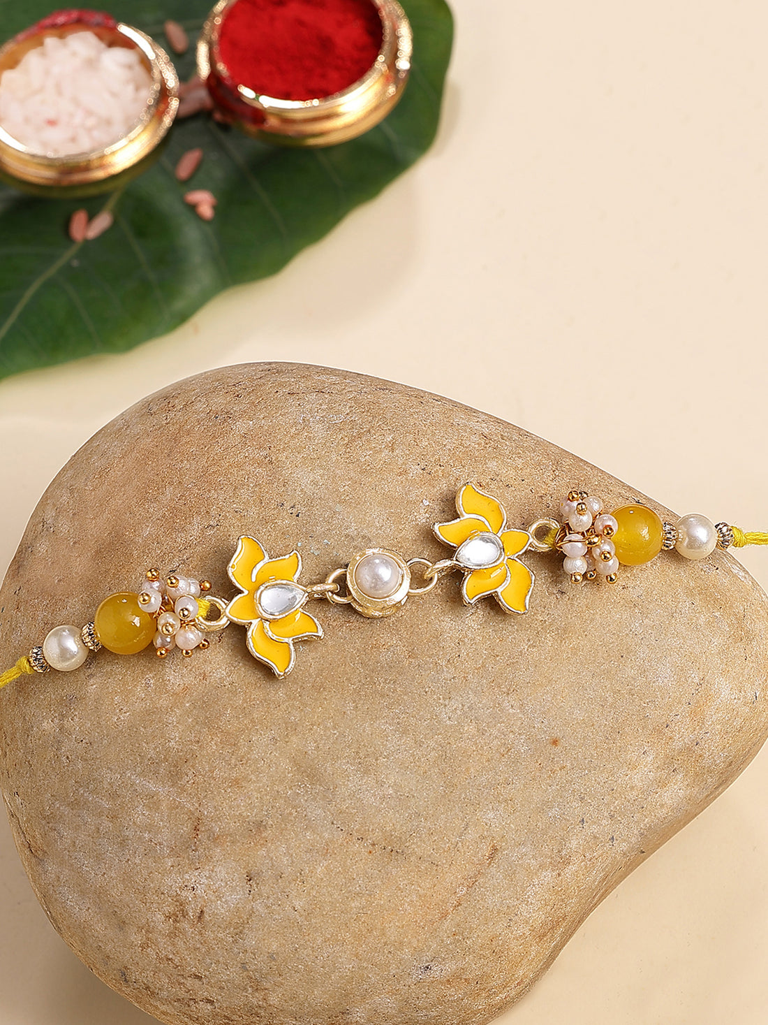 Karatcart Gold Plated Yellow Meena Lotus Kundan Bhiya Rakhi with Roli & Chawal