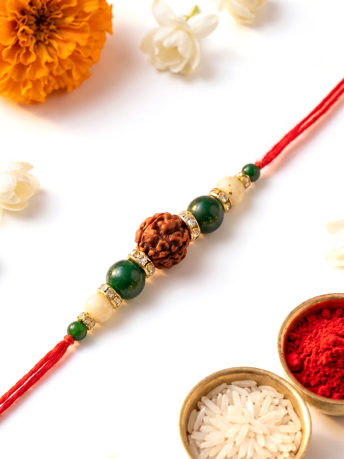 KARATCART Gold Plated Rudraksha and Green Beads Bhaiya Rakhi with Roli & Chawal