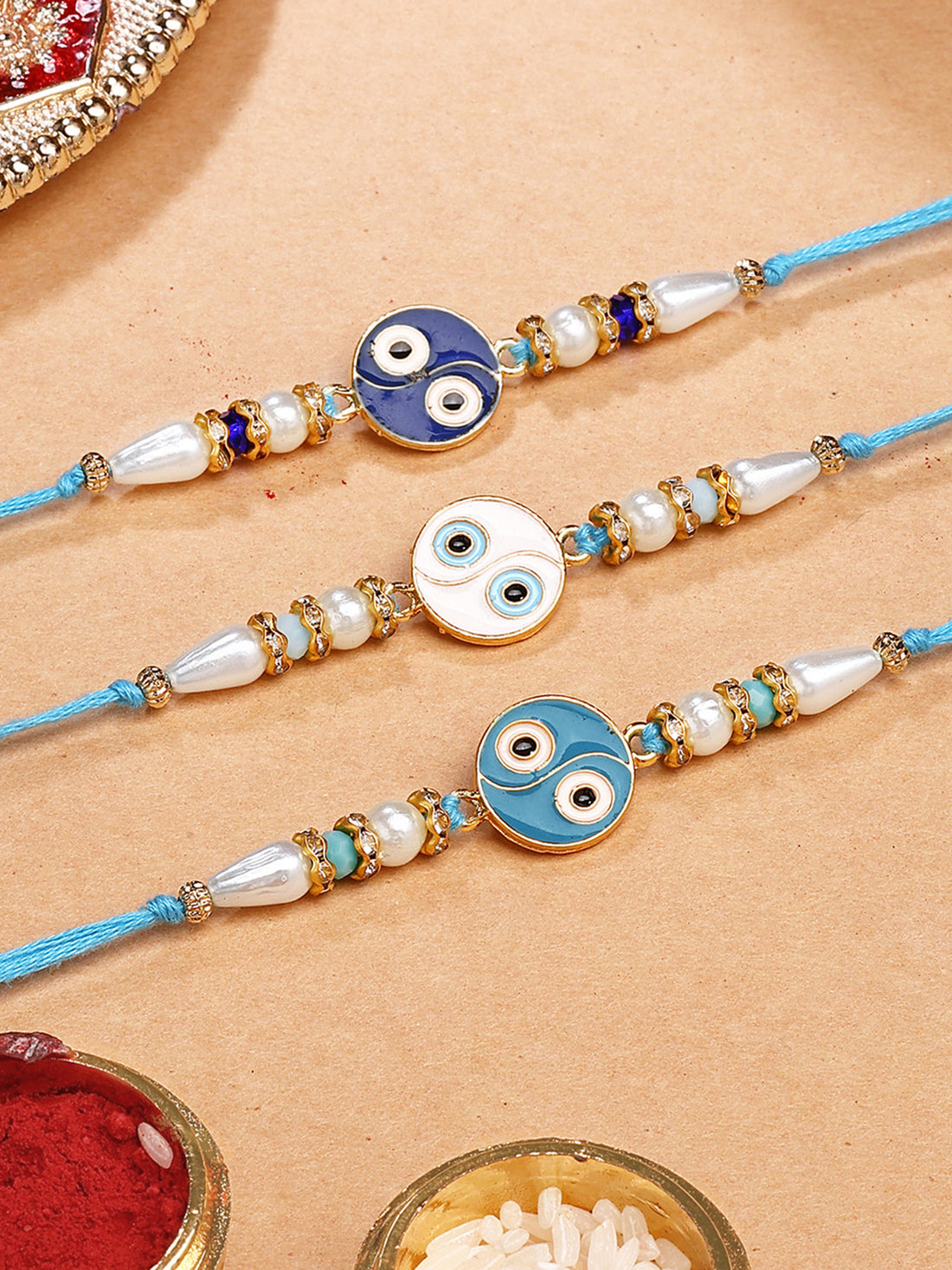 Karatcart Set of 3 White and Blue Enamel Evil Eye Rakhi for Brother with Roli & Chawal