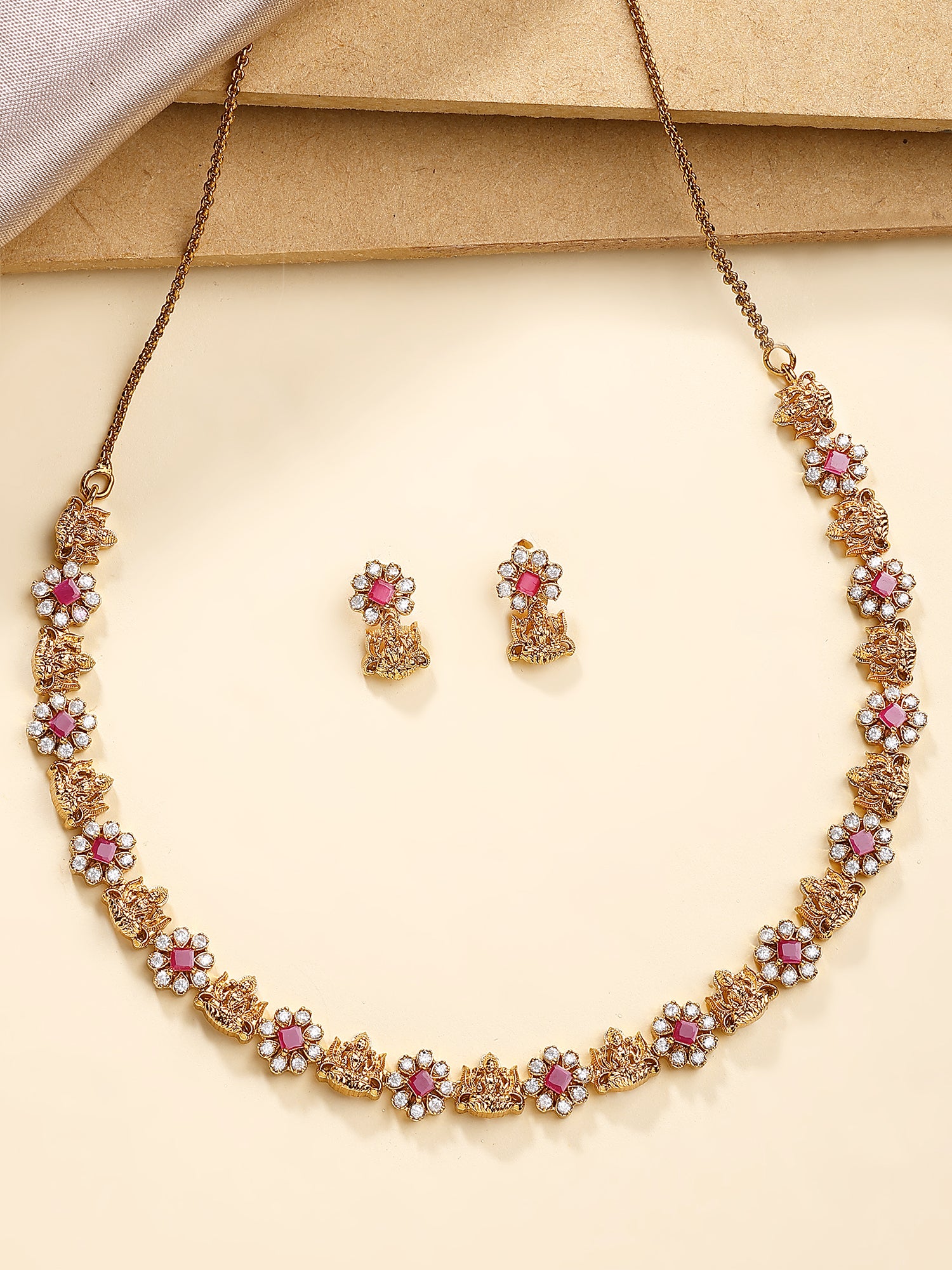 KARATCART Traditional Gold-Plated Laxmi Mata Red American Diamond Temple Jewellery Set for Women - Image 1