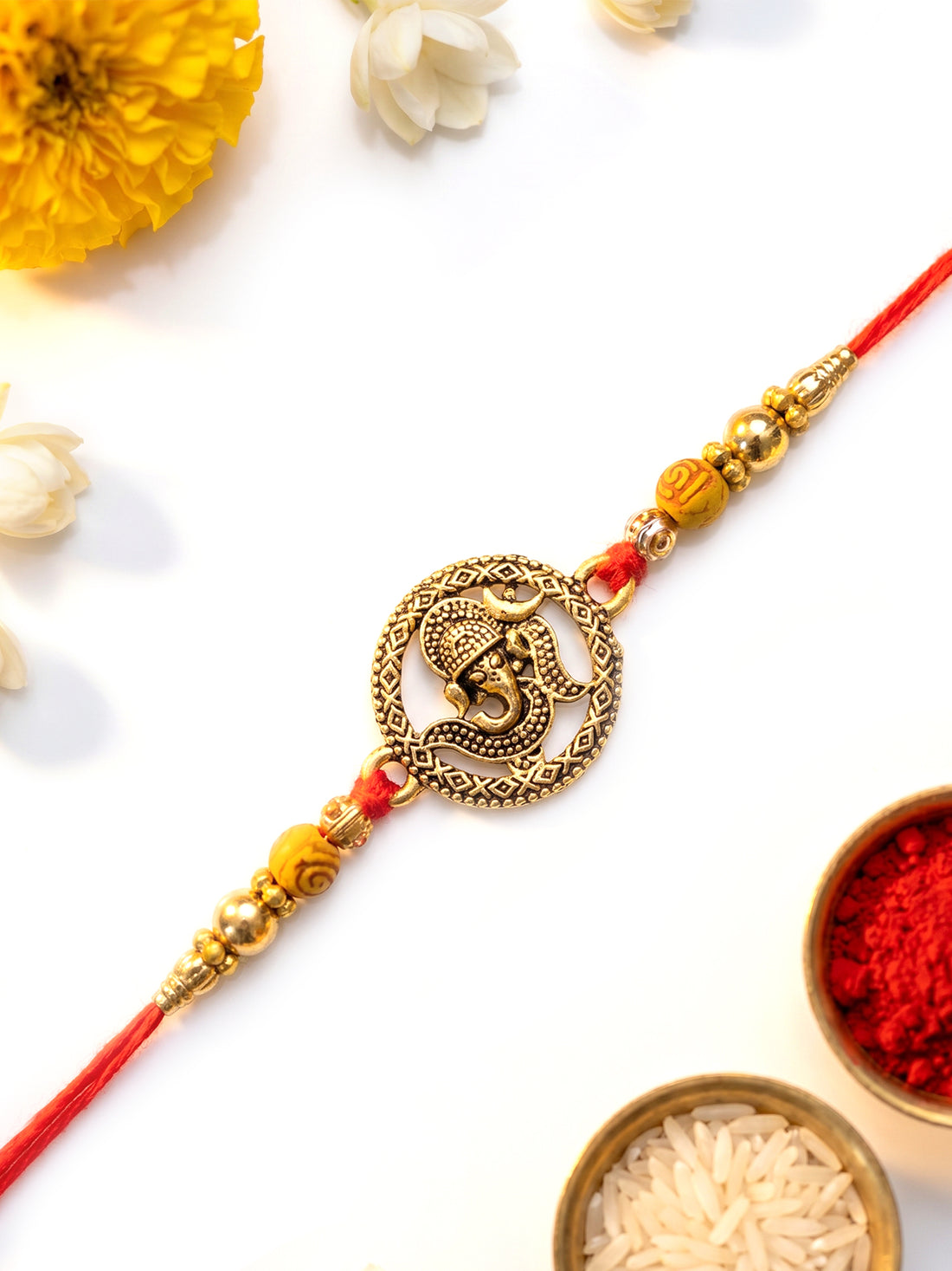 KARATCART Gold Plated Antique Ganesha Designer Bhaiya Rakhi with Roli & Chawal
