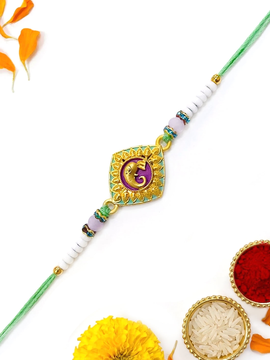 KARATCART Gold Plated Purple Meenakari Lord Ganesha Bhaiya Rakhi with Roli & Chawal