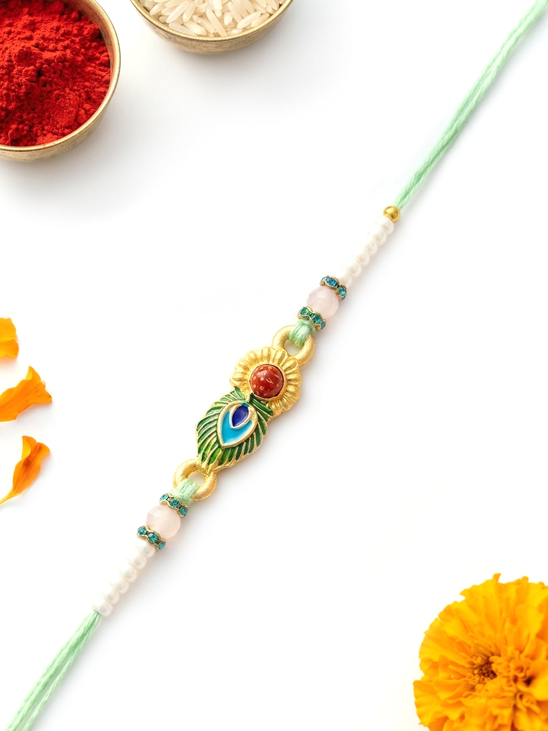 KARATCART Gold Plated Rudraksha and Peacock Feather Design Bhaiya Rakhi with Roli & Chawal