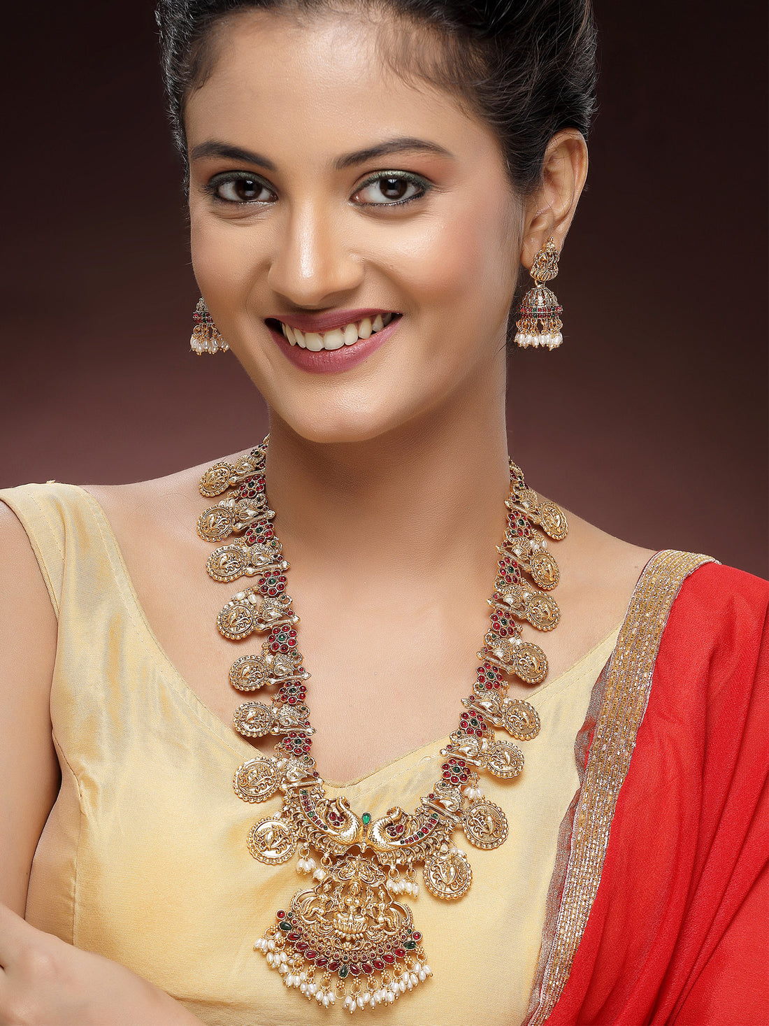 KARATCART Traditional Gold-Plated Laxmi Mata and Peacock Rani Haar Temple Jewellery Set for Women