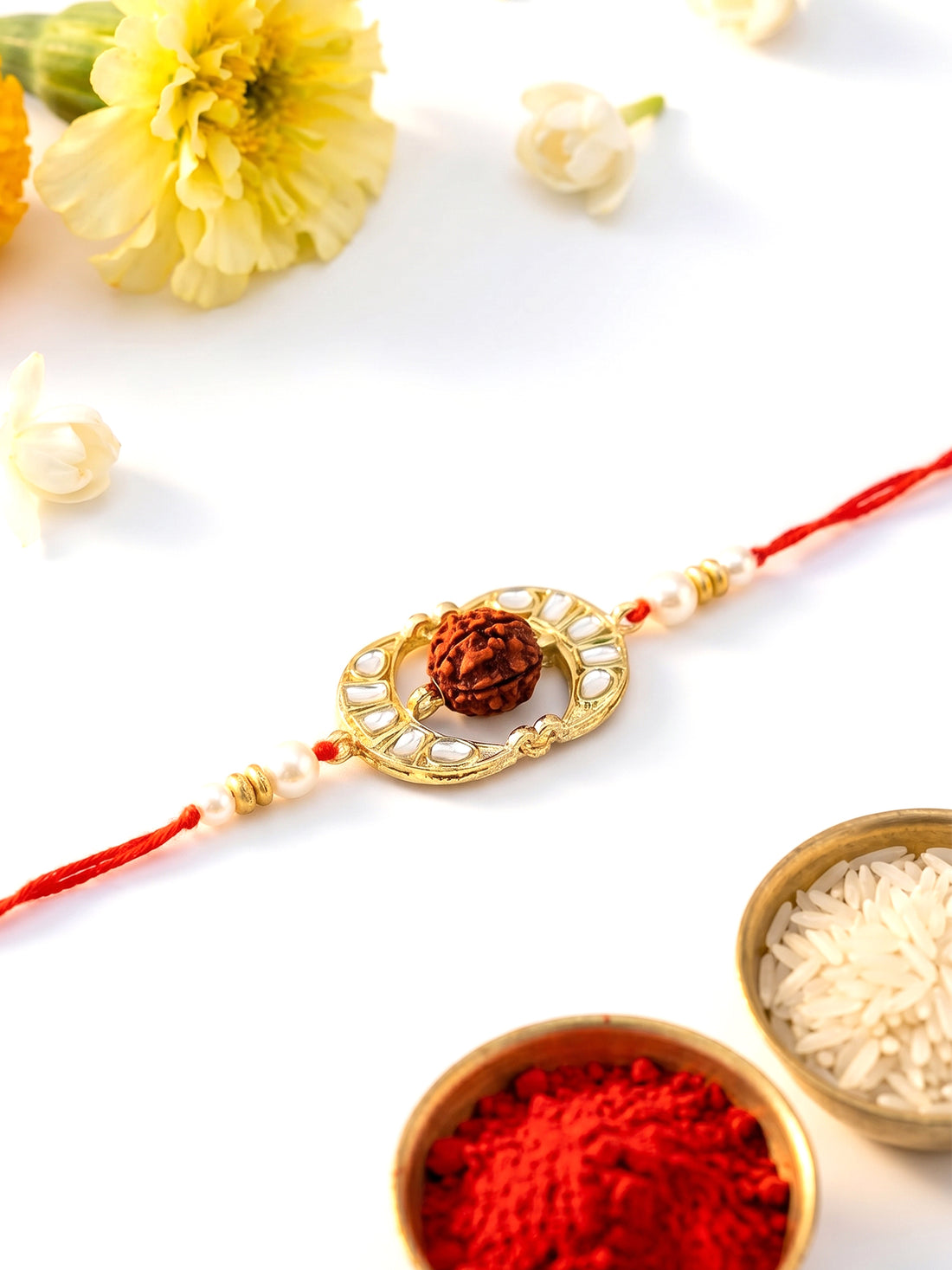 KARATCART Gold Plated Oval Kundan Rudraksha Bhaiya Rakhi with Roli & Chawal