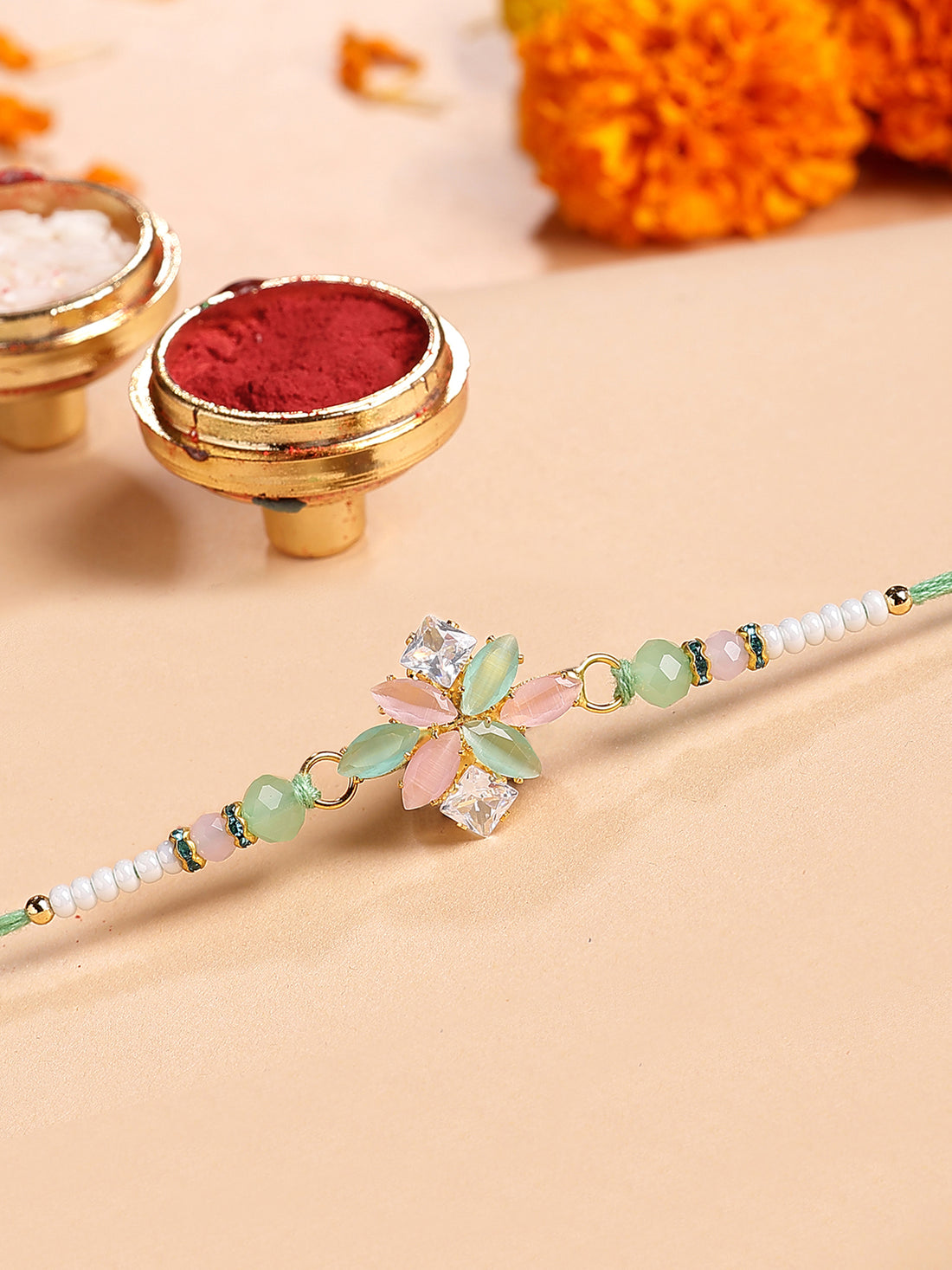 Karatcart Lime Green and Peach Rhinestones Floral Bhiya Rakhi with Roli & Chawal