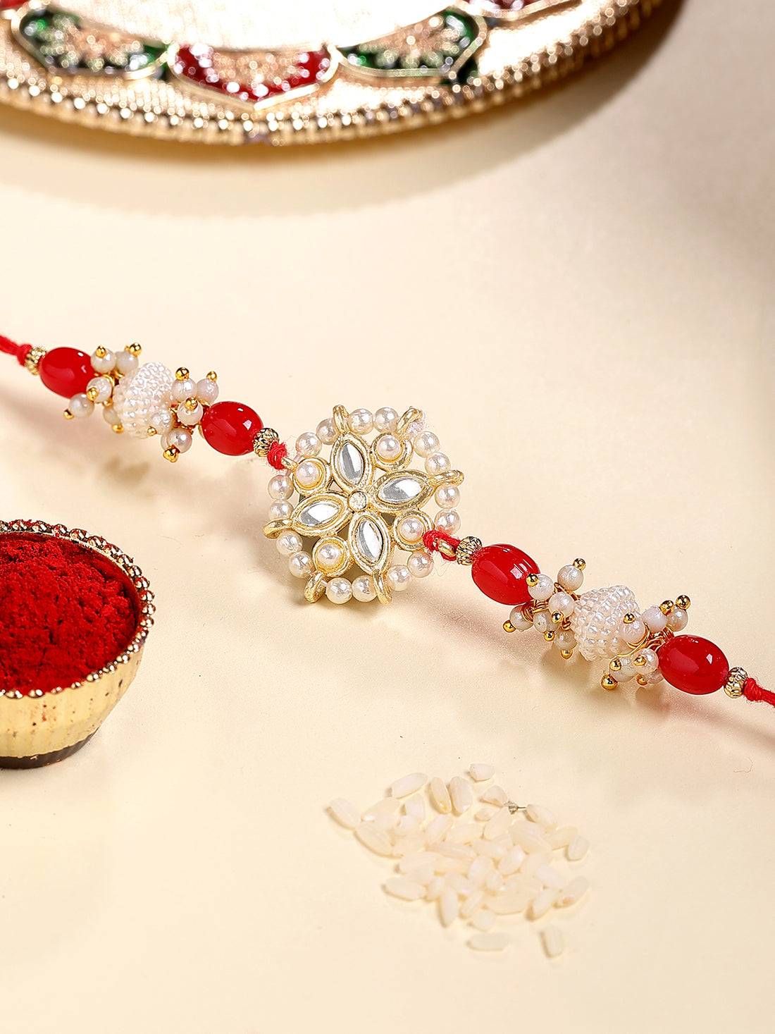 Karatcart Gold Plated Red Beads Kundan Bhiya Rakhi with Roli & Chawal