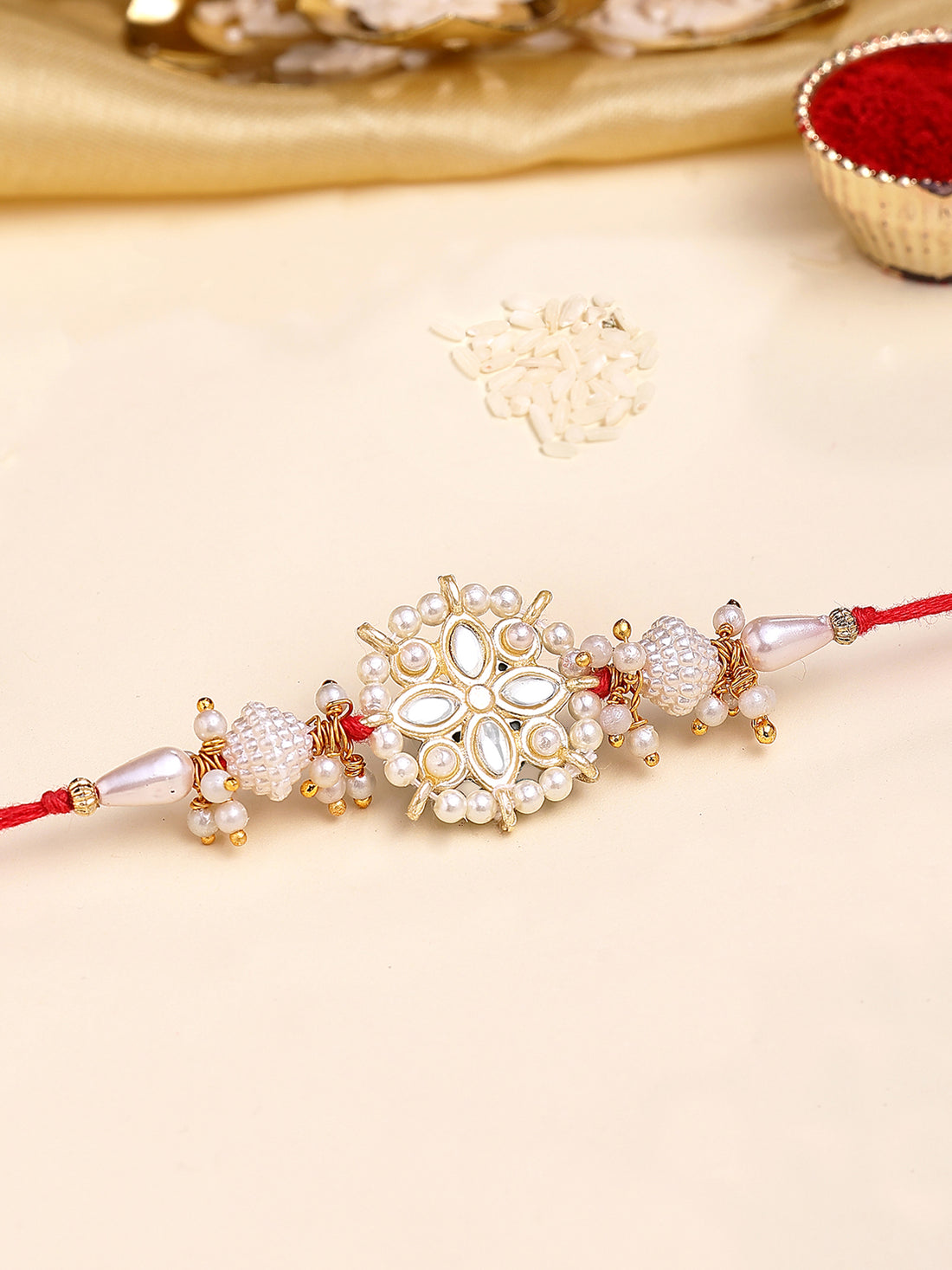 Karatcart Gold Plated White Meena and Pearl Floral Kundan Bhiya Rakhi with Roli & Chawal