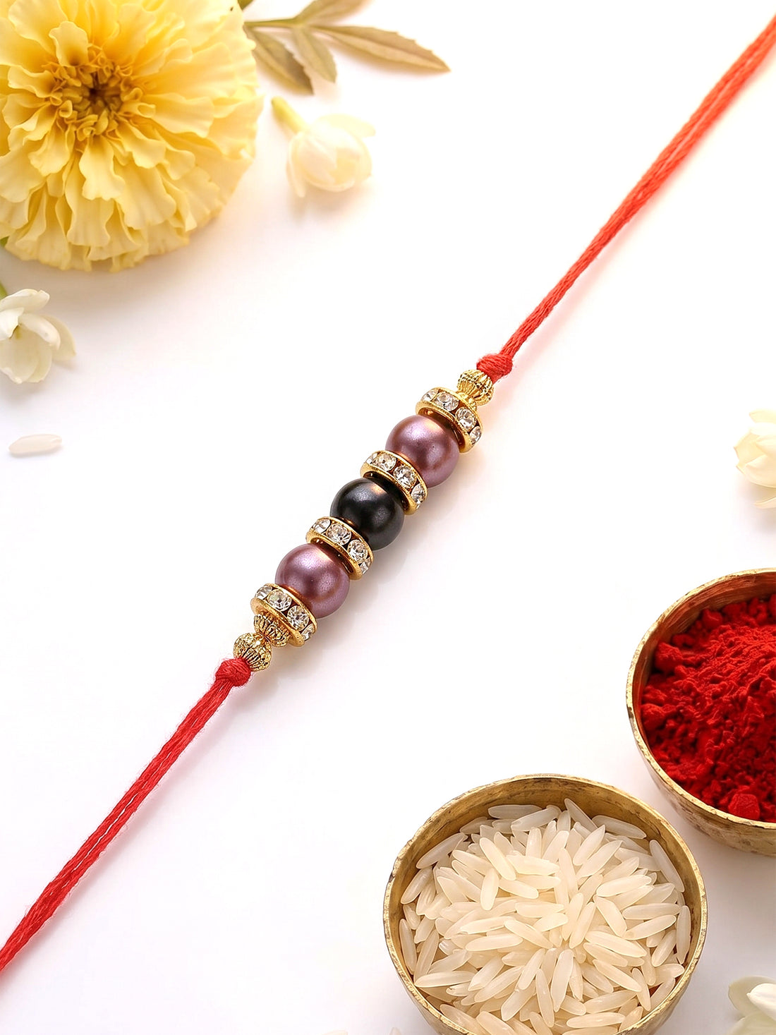 KARATCART Elegant Light Weight Blue and Purple Pearl Handmade Rakhi for Brother with Roli & Chawal