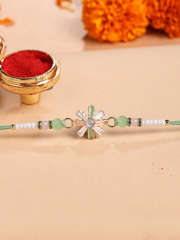 KARATCART Peach and Lime Green Rhinestones Floral Bhaiya Rakhi with Roli & Chawal