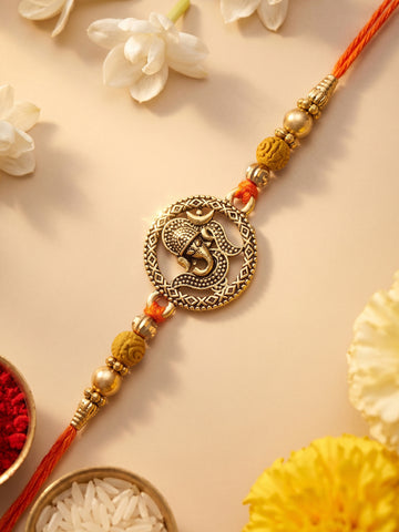 KARATCART Gold Plated Antique Ganesha Designer Bhaiya Rakhi with Roli & Chawal
