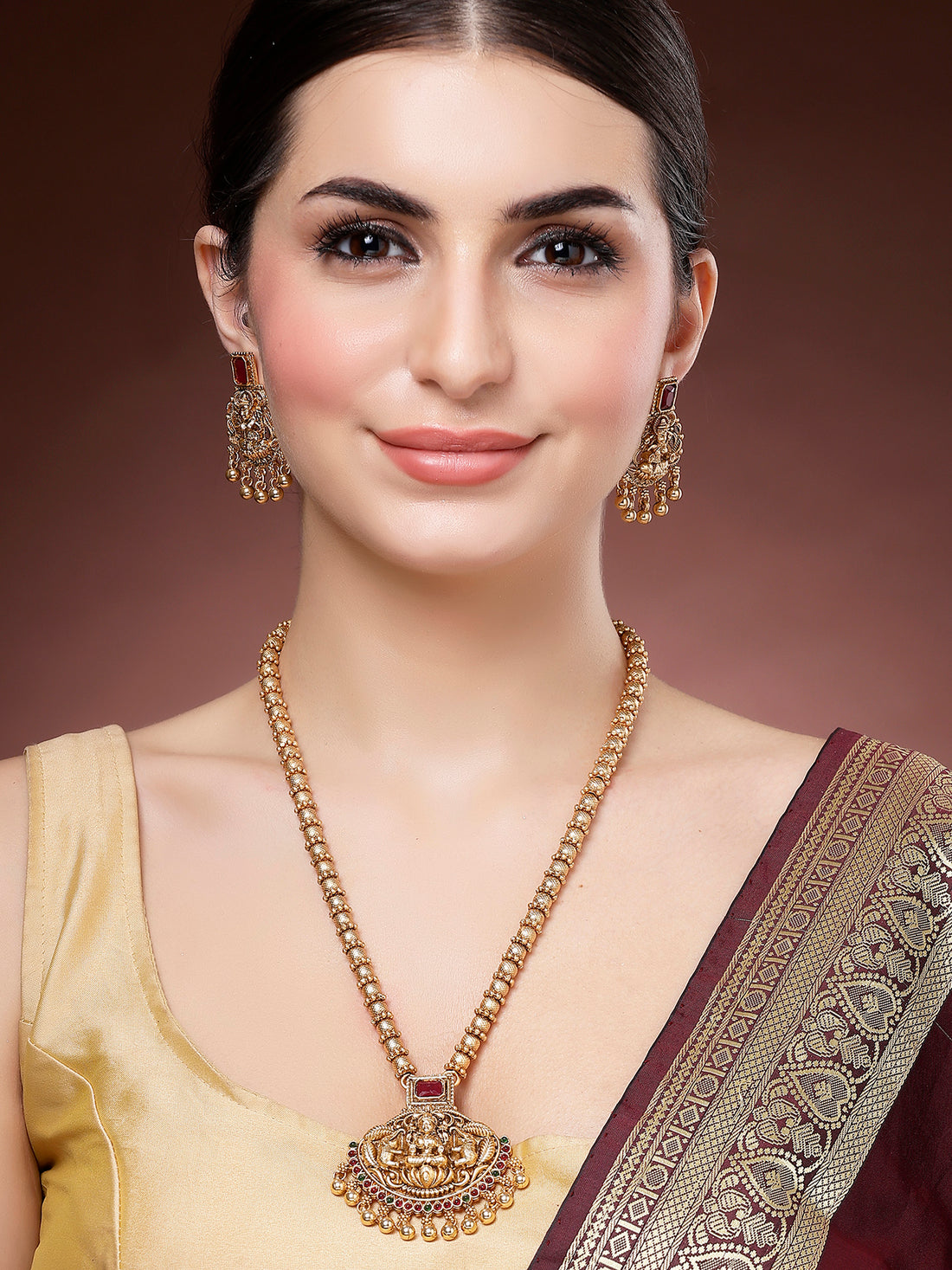 Karatcart Red Stone Gold Plated Laxmi Mata Engraved Long Temple Necklace Set for Women